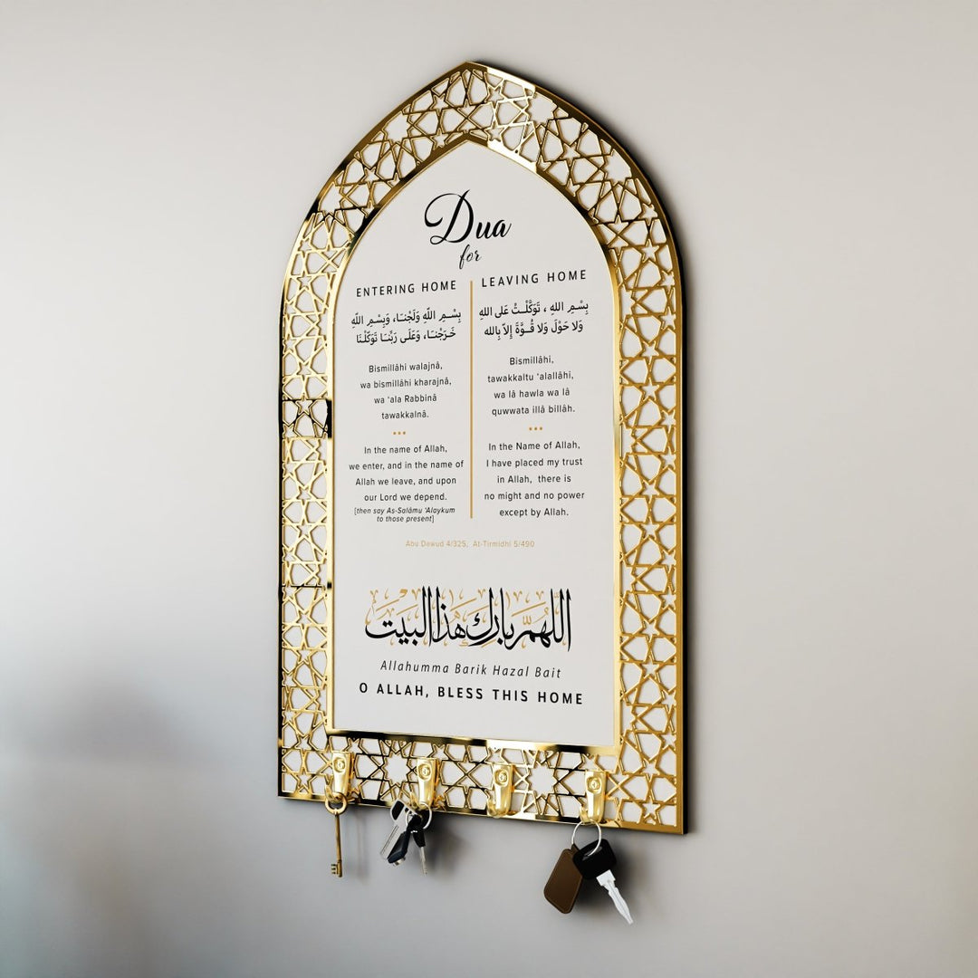 An arched white key holder with a gold geometric border, printed with the duas for entering and leaving the home in Arabic, transliteration and English