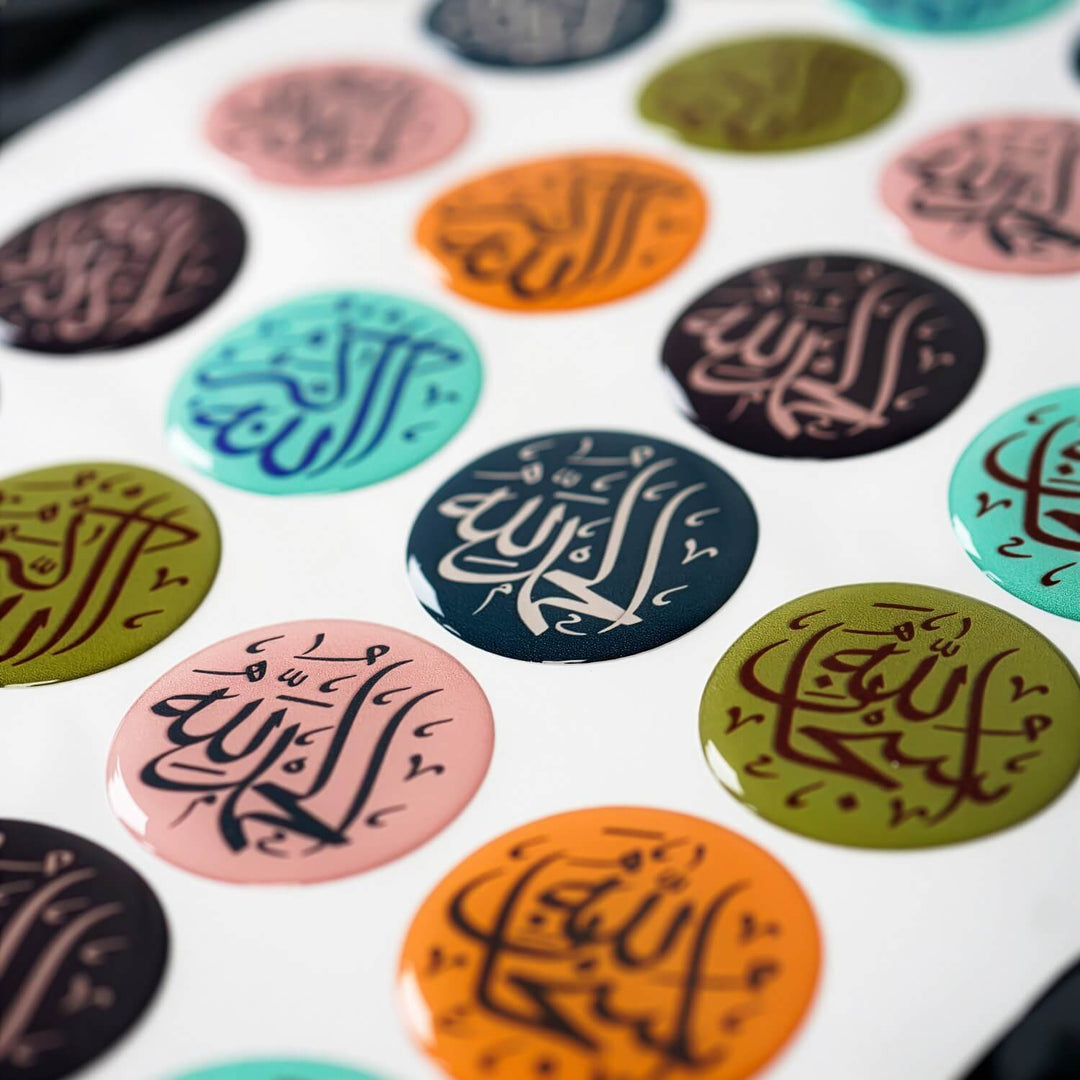 Colorful round stickers with Arabic calligraphy on a white background