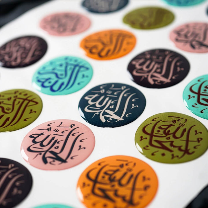 Colorful round stickers with Arabic calligraphy on a white background