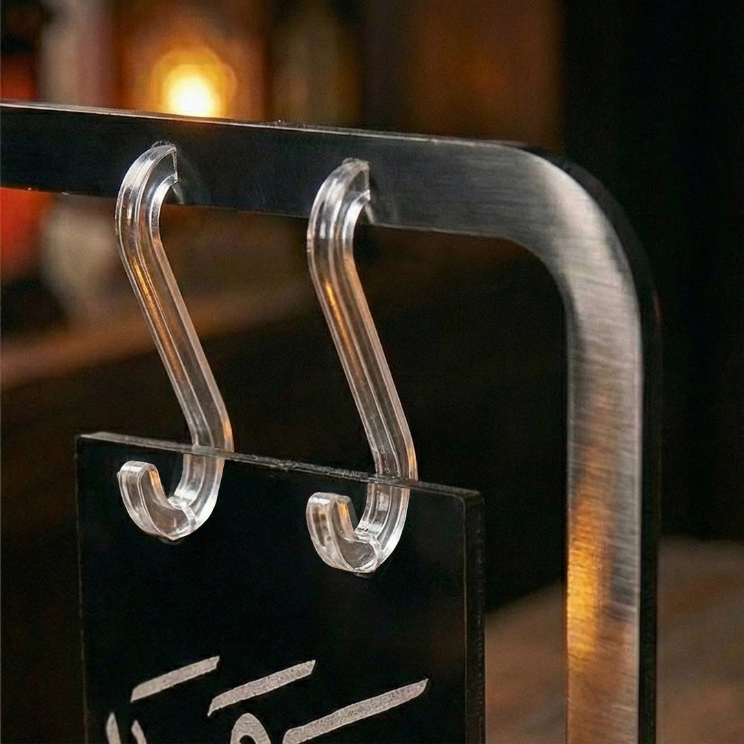 Clear acrylic hooks holding the Saha w Hana banner sign