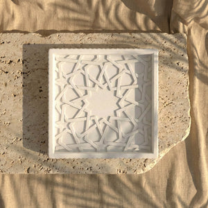 Top view of the Alhambra Mexuar Pattern white stone relief on a travertine slab