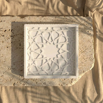 Top view of the Alhambra Mexuar Pattern white stone relief on a travertine slab