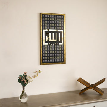 Gold 99 Names of Allah Kufic wall art above a console with a Quran stand and a glass vase