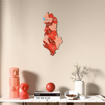 Flag colored Albania wooden wall map above a marble console, front view