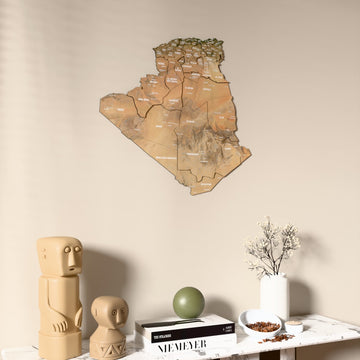 Satellite Algeria wooden wall map on a beige wall above a console with figurines