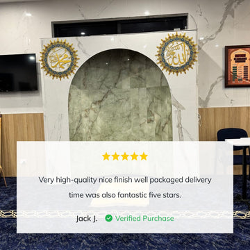 Customer photo of the Allah and Muhammad circular metal wall art set on a marble wall with a review from Jack J.