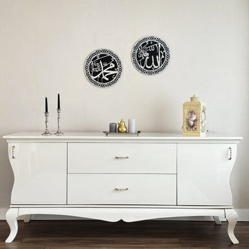 Silver Acrylic Allah and Mohammad circle wall art pair hung above a white sideboard with candlesticks