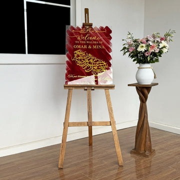 Wedding sign on an easel with a flower vase on a wooden stand, wide view of the room