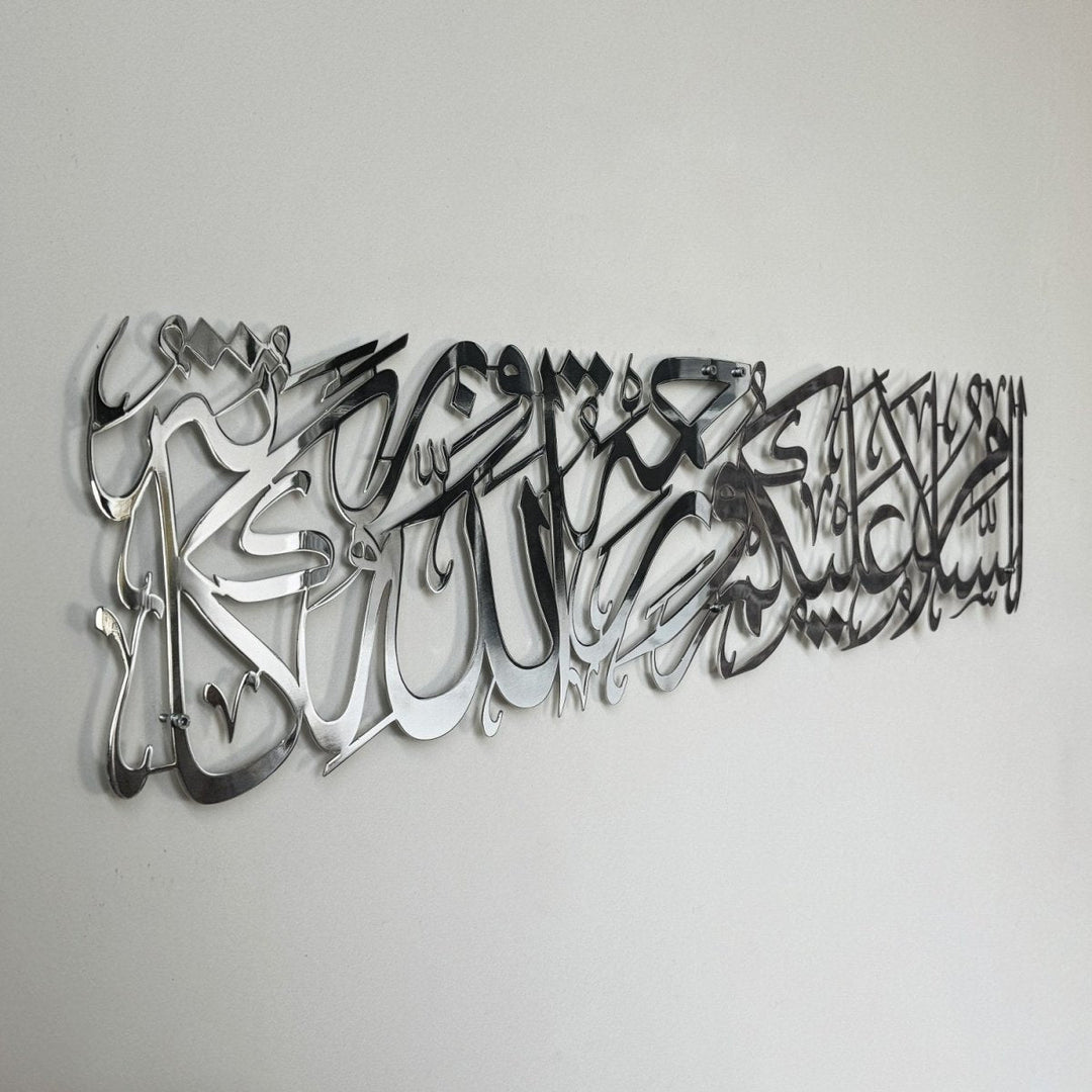 Shiny silver metal Assalamu Alaikum calligraphy, close side angle with a mirror-like surface