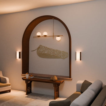 Gold ship-shaped Auzu Basmala metal wall art in an arched niche, angled view with a sofa in front