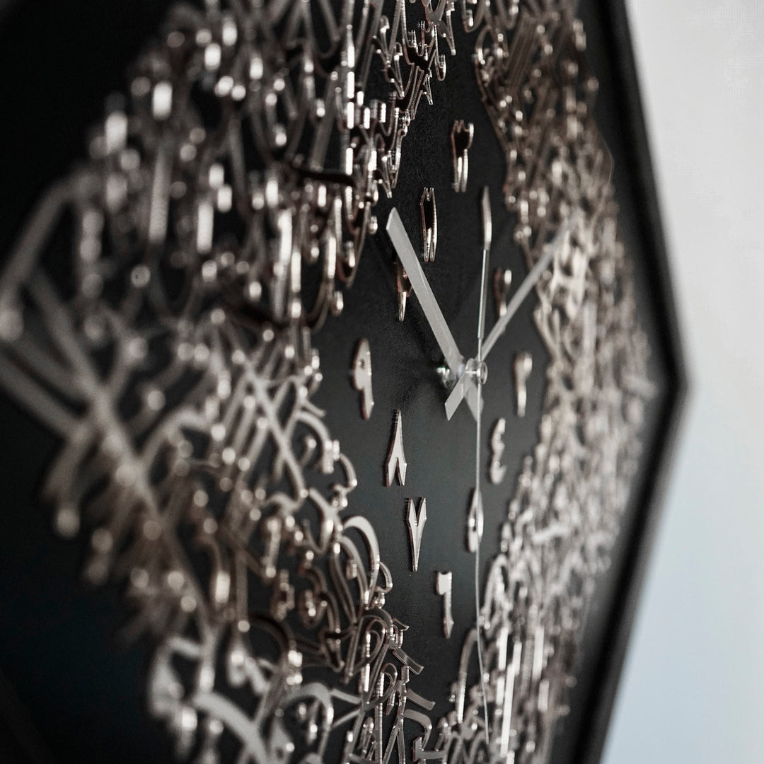Close-up of the raised silver acrylic Ayatul Kursi calligraphy and silver clock hands