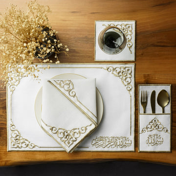 Gold Basmala dining set place setting with plate, napkin, coaster and cutlery pouch, top view