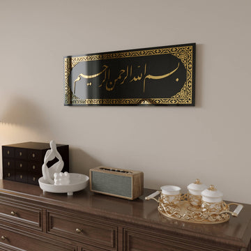 Side-angle view of the Bismillah Jali Diwani tempered glass wall art with Gold acrylic above a dresser with a decor tray