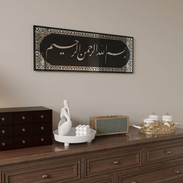 Close angled view of the Bismillah Jali Diwani tempered glass wall art with Silver acrylic on a beige wall