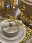 Gold Bismillah napkin ring on a white and gold place setting