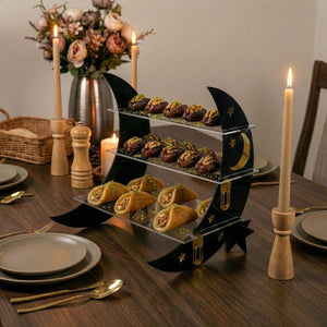 Gold on Black crescent moon tiered serving stand with dates and pastries on a set iftar table