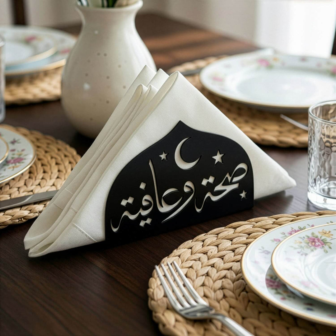 Saha w Afia metal napkin holder in black on a set table