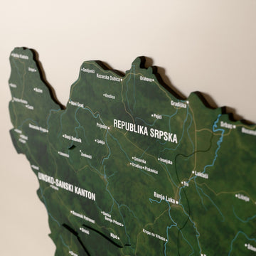 Close-up of the Satellite Bosnia and Herzegovina wooden wall map with layered regions and printed names