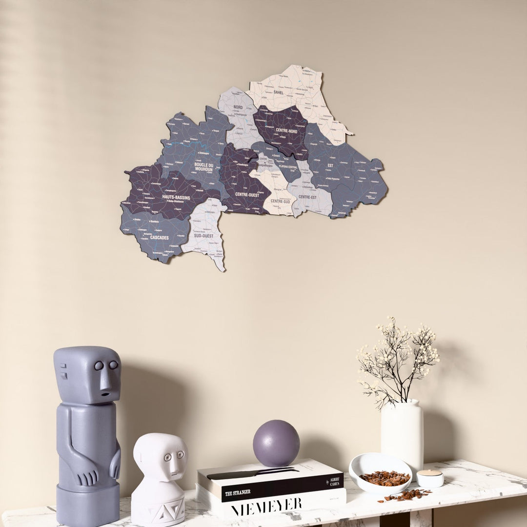 Nimbus Burkina Faso wooden wall map on a beige wall above a console with figurines