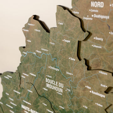 Close-up of the Satellite Burkina Faso wooden wall map with layered regions and printed names