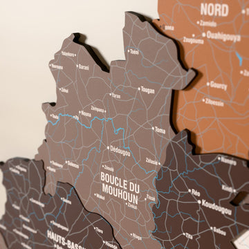 Close-up of the Soil Burkina Faso wooden wall map with layered regions and printed names