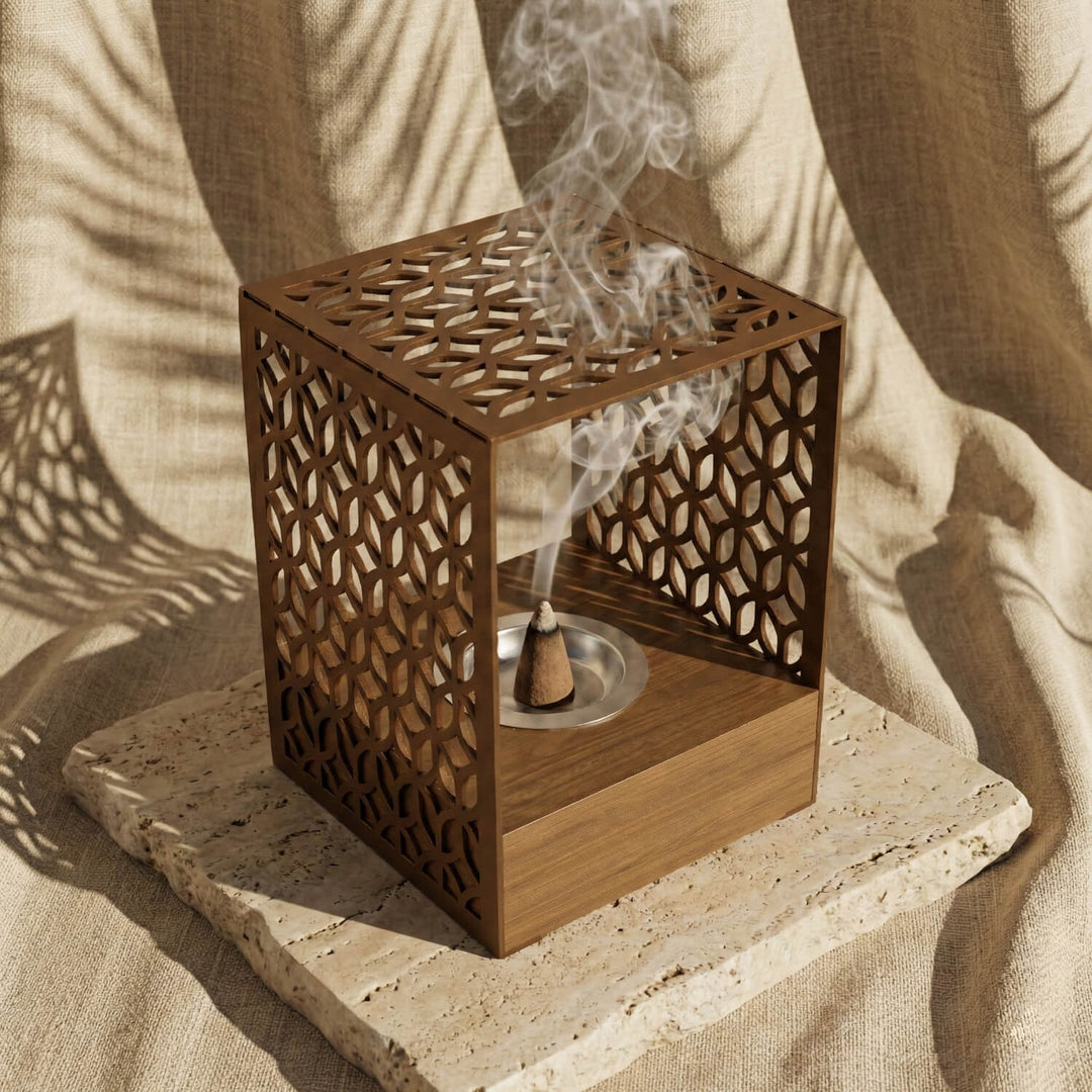 Wooden base mabkhara with a copper Petal Lattice metal frame, close view with incense smoke