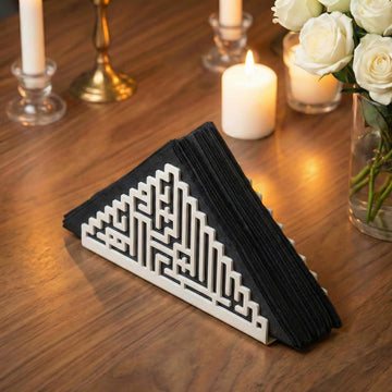 Bismillah Kufic metal napkin holder in white on a set table