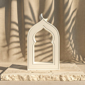 White stone mihrab arch with crescent moon on a travertine slab, slightly angled view