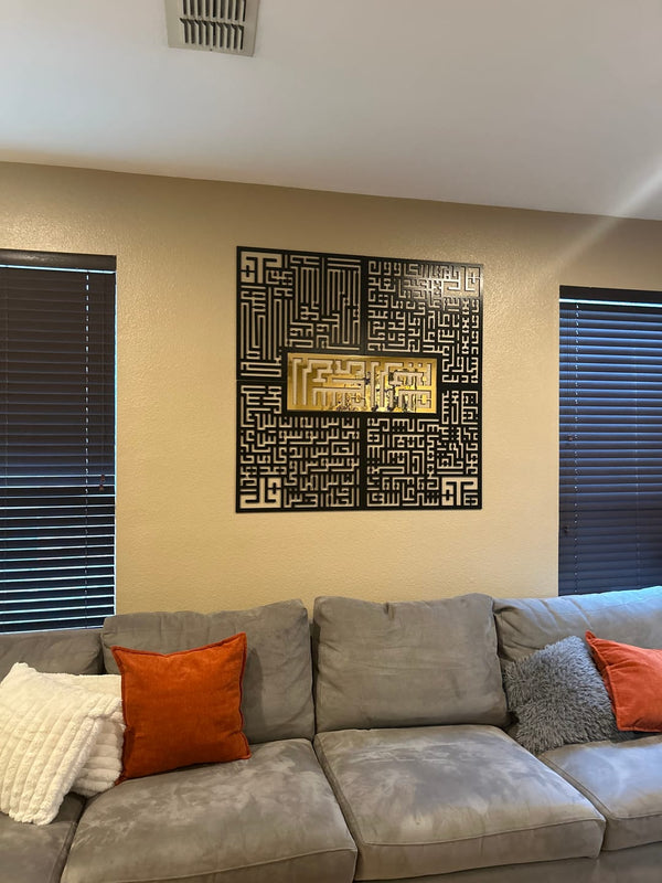 Customer photo of black and gold Kufic panels above a gray sofa
