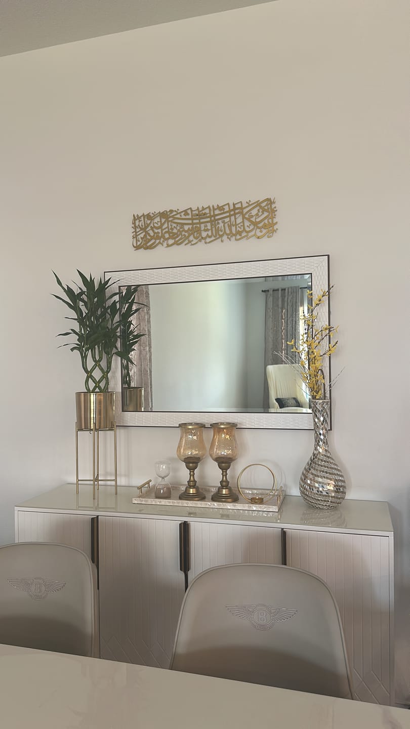 Customer photo of gold Arabic calligraphy above a mirror and console table