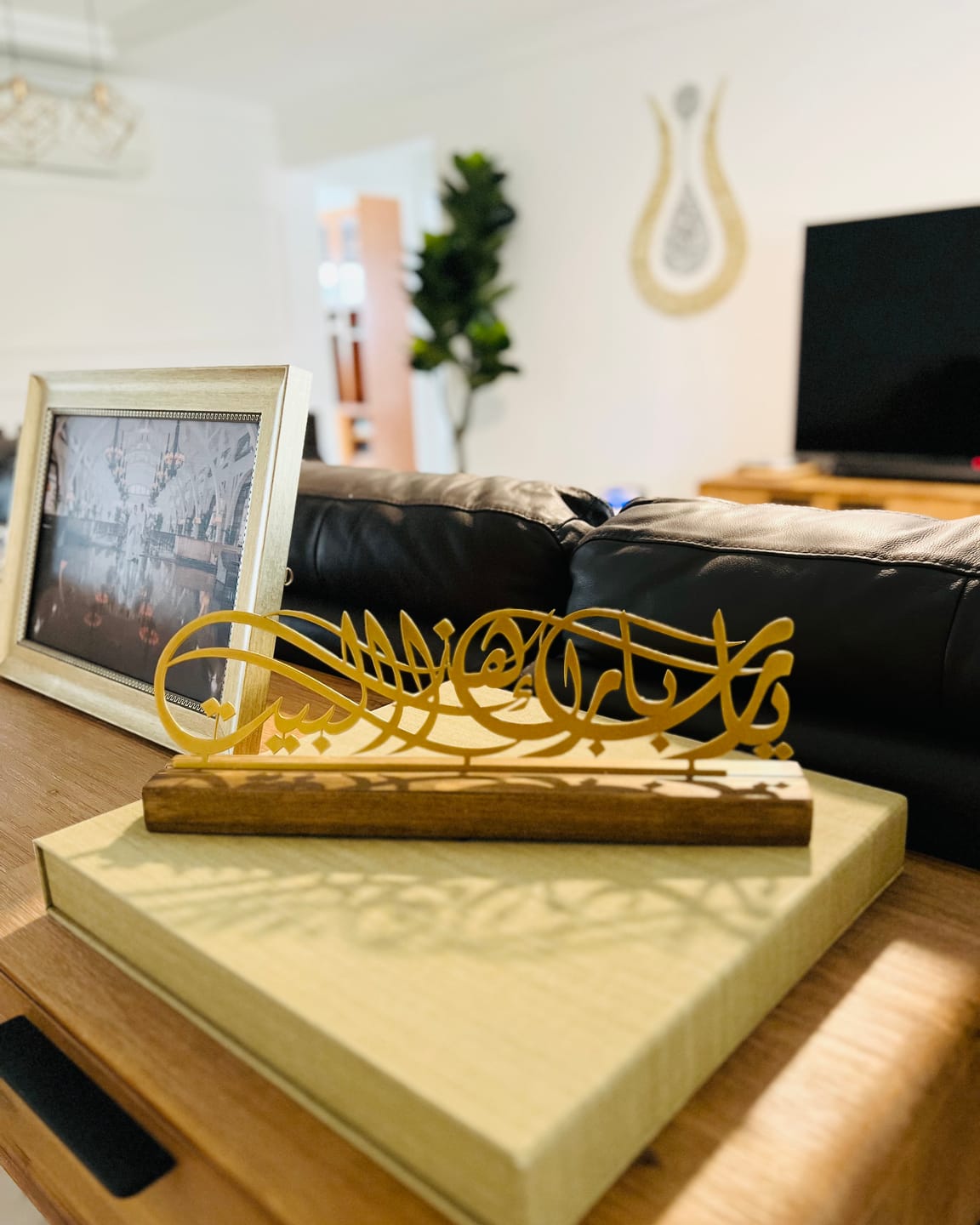 Customer photo of gold calligraphy table decor on a wooden base