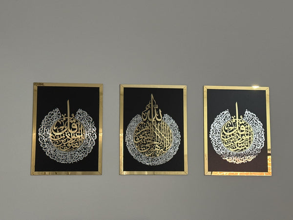 Customer photo of three framed gold and silver calligraphy panels on black backgrounds