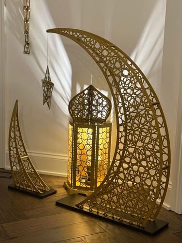 Customer photo of a large gold crescent and lantern floor decor
