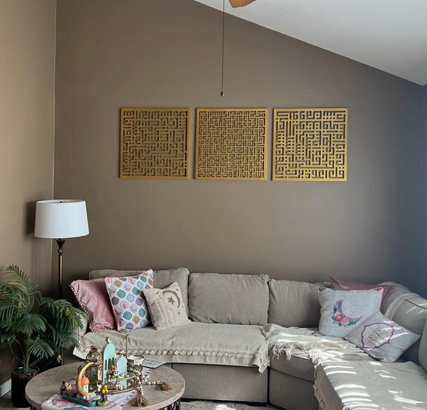 Customer photo of a gold Kufic calligraphy triptych above a corner sofa