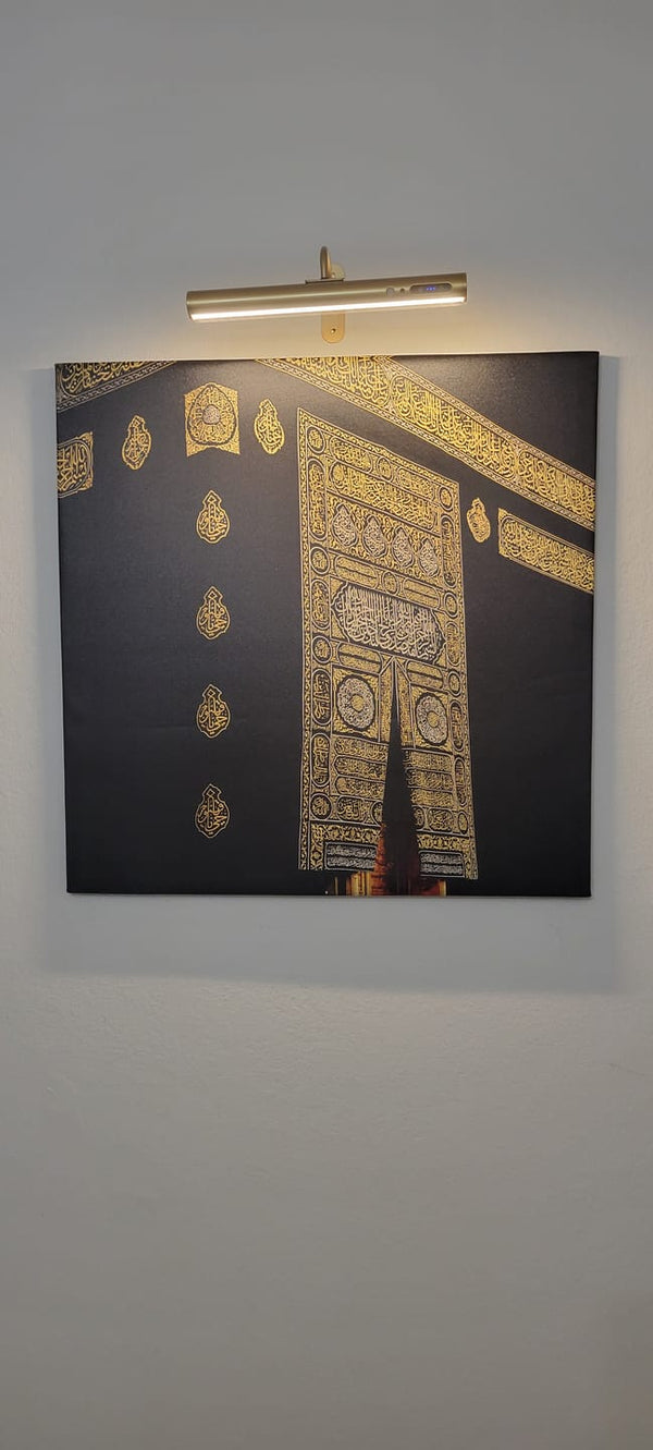 Customer photo of a Kaaba door canvas print under a picture light
