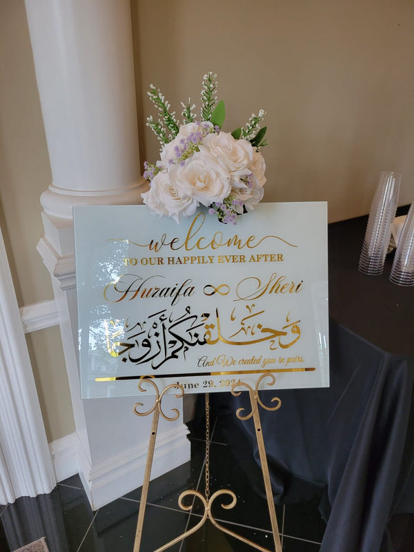 Customer photo of a mirrored nikkah welcome sign with flowers on a gold easel