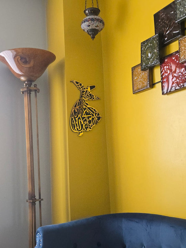 Customer photo of gold whirling dervish wall art on a yellow wall
