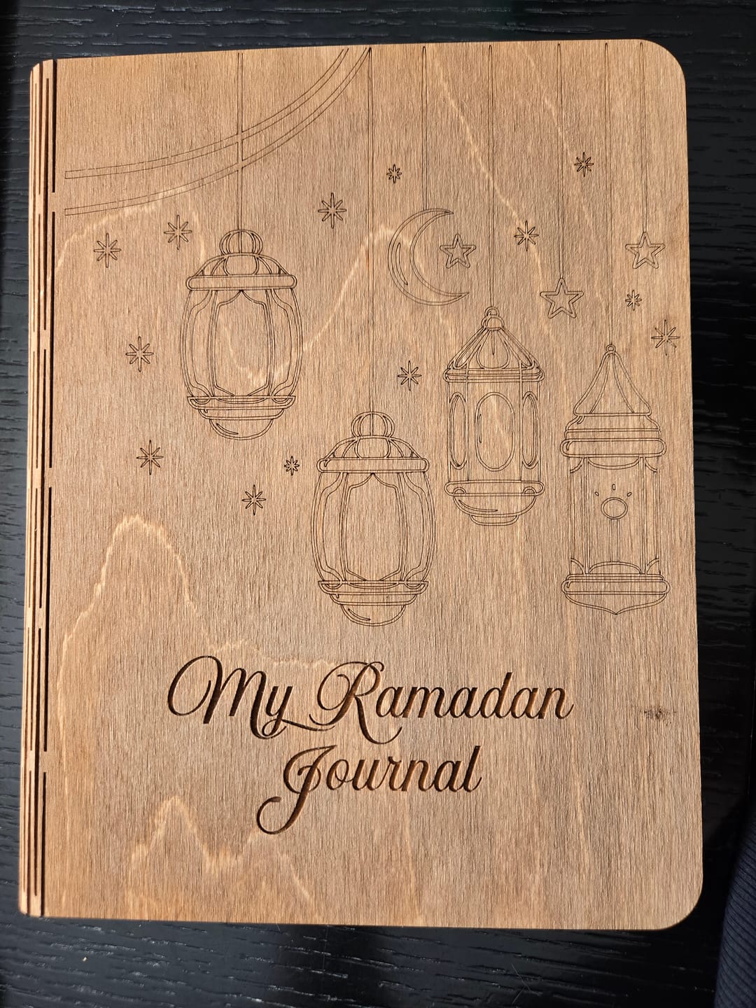Customer photo of a wooden My Ramadan Journal cover engraved with lanterns