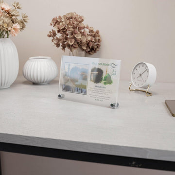 Design 1 Hajj Mabroor table decor on a white desk, wide view with a vase and clock