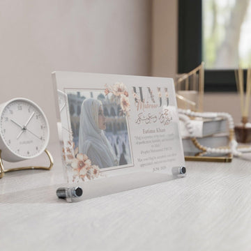 Design 2 Hajj Mabroor table decor from the left, showing the floral frame and Fatima Khan text