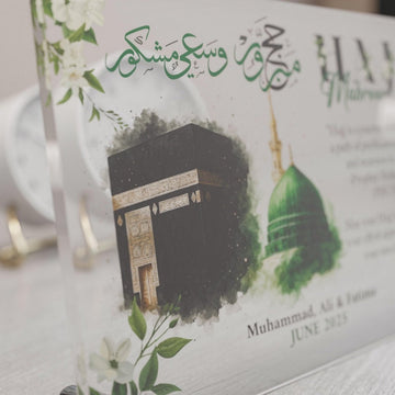 Angled close-up of Design 3 Hajj Mabroor table decor showing the Kaaba and dome artwork
