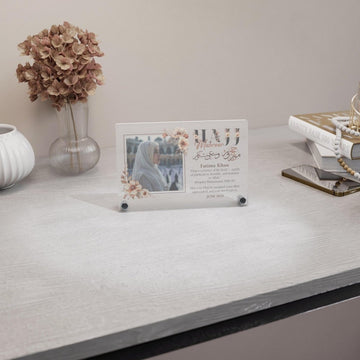 Design 2 Hajj Mabroor table decor with a woman's photo, wide view on a desk
