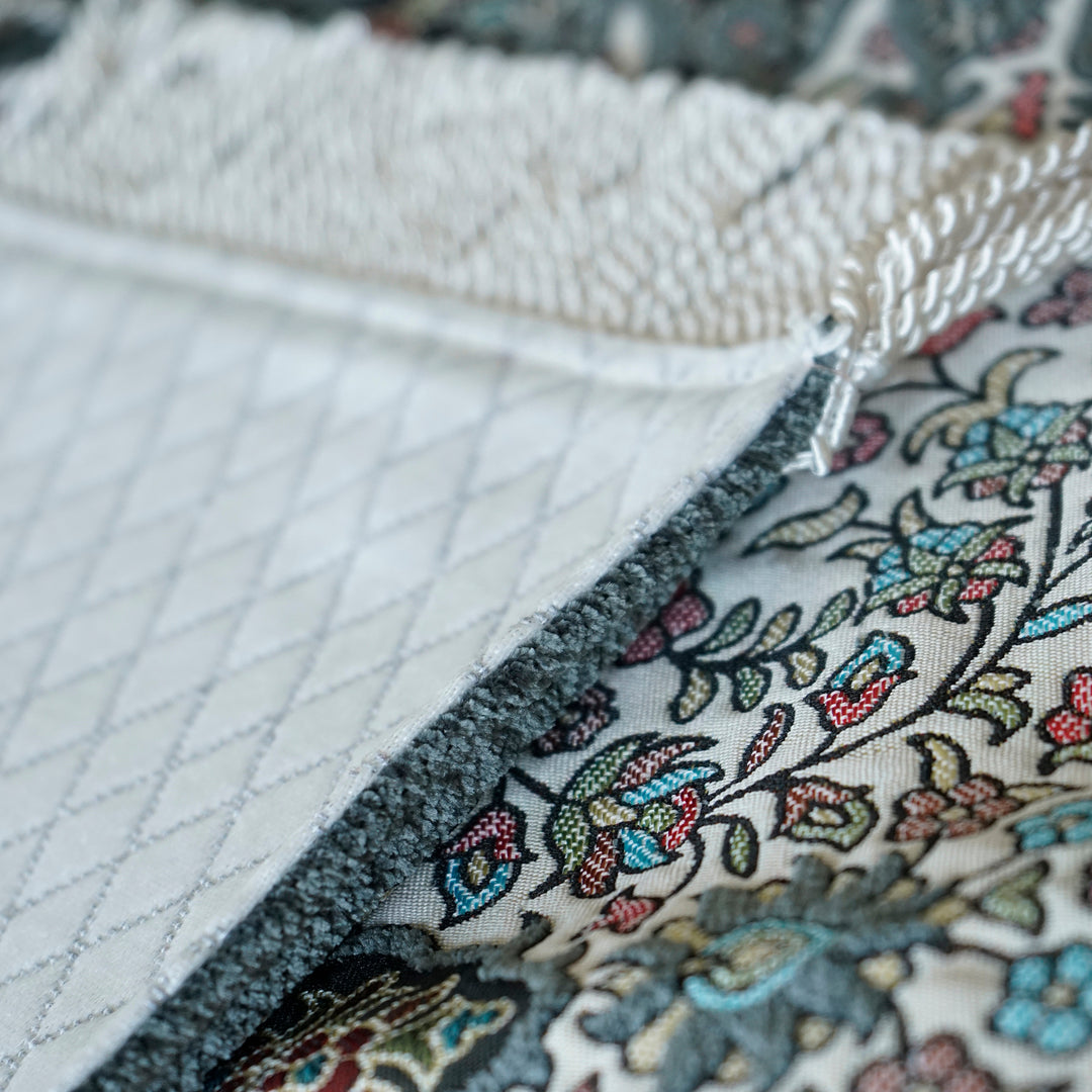 Floral Vine Prayer Rug: close-up of the front pattern, fringe and quilted backing