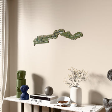Satellite Gambia wooden wall map beside a sheer curtain, angled view
