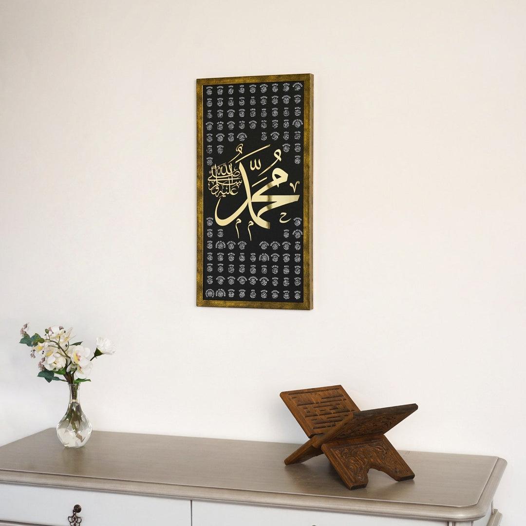 Gold 99 Names of Prophet Muhammad Thuluth panel above a console with a Quran stand