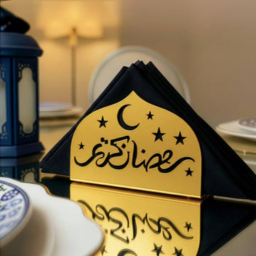 Ramadan Kareem metal napkin holder in gold on a set table