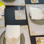 Embroidered geometric border placemat set on a dining table, shared by @rehabreshid
