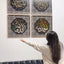 Four dhikr wall art panels above a sofa, shared by @chimaschef