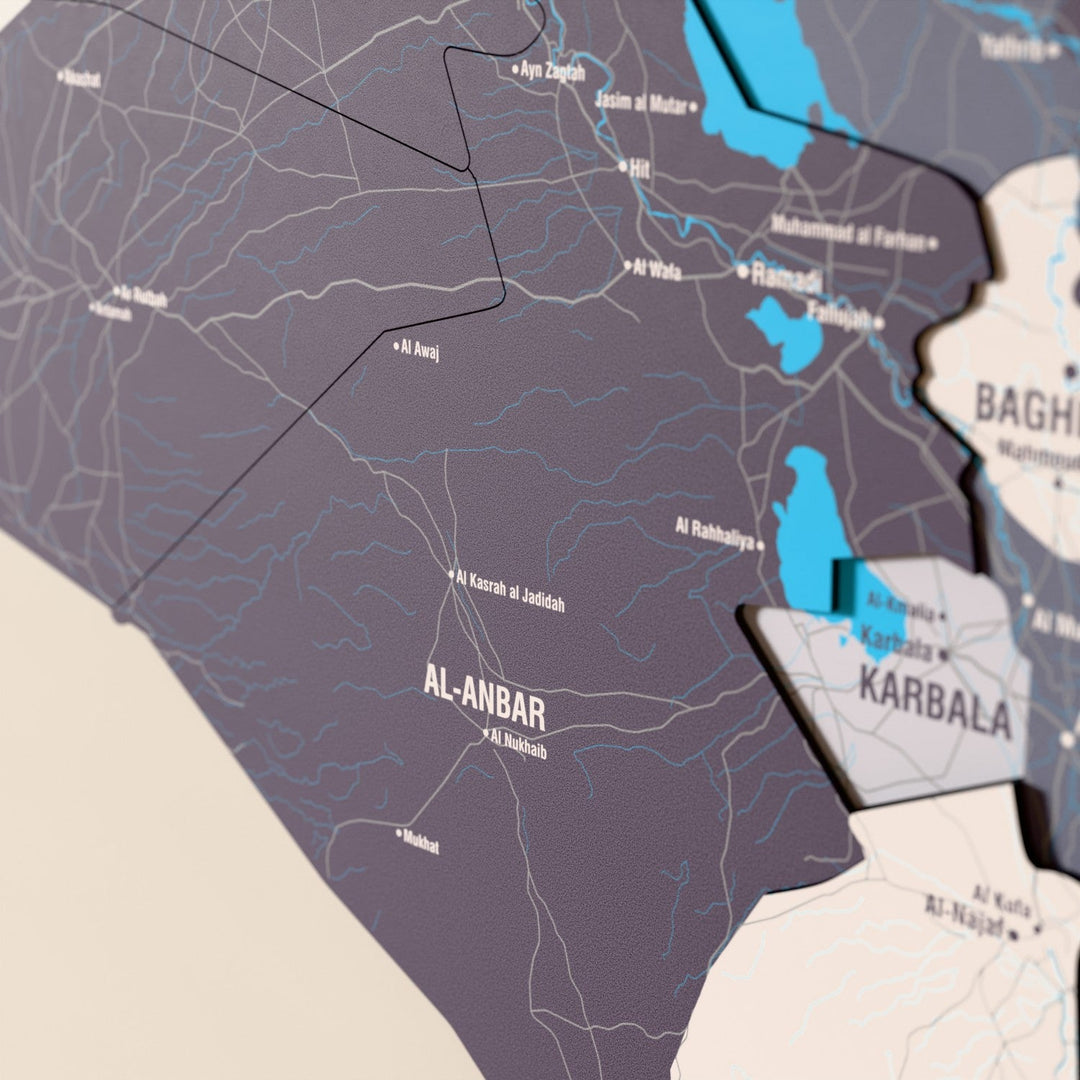 Close-up of the Nimbus Iraq wooden wall map with layered regions and printed names