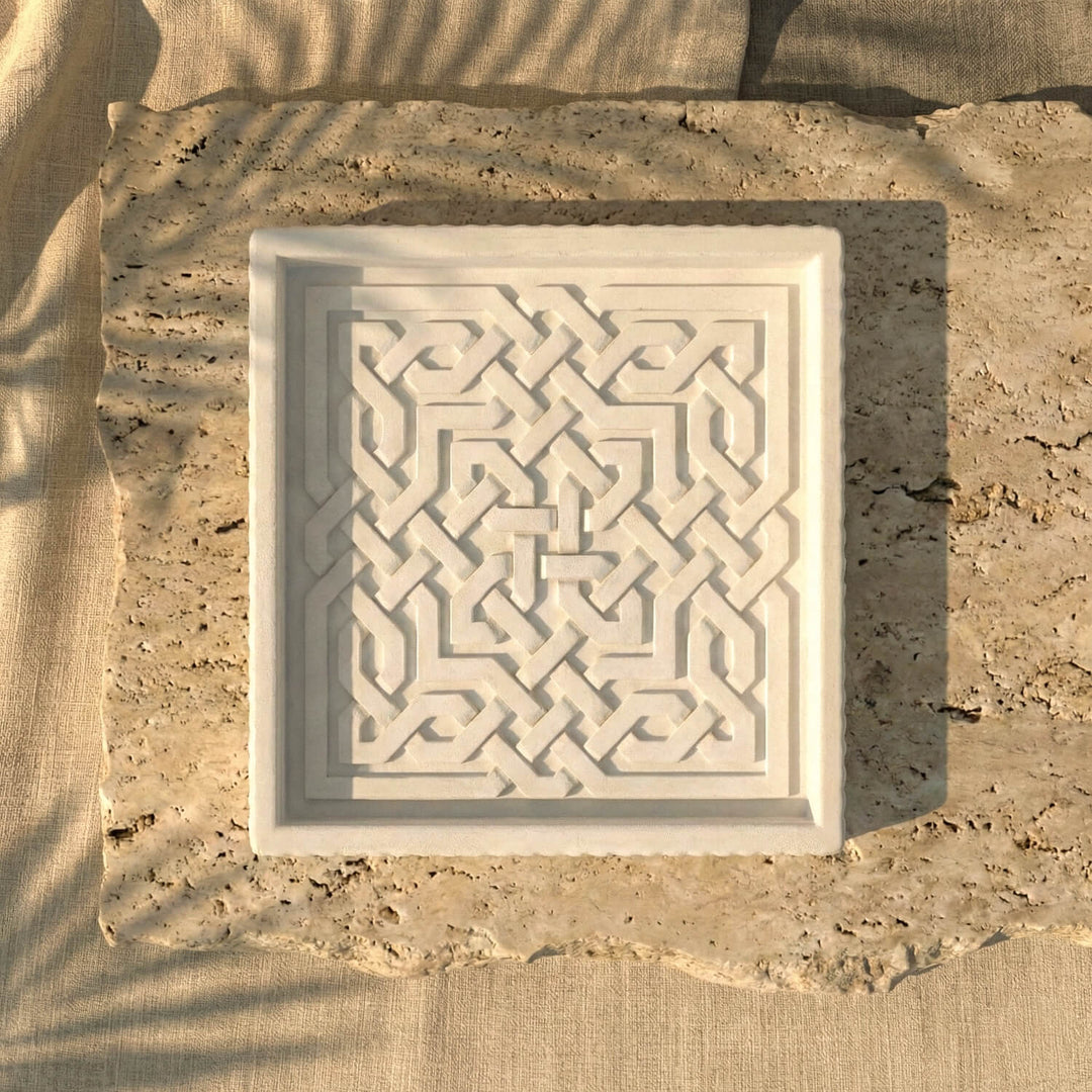 White ceramic Islamic geometric tray displayed on natural stone, modern tabletop home decor